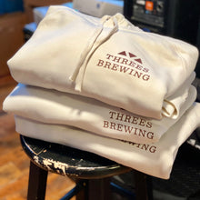 Load image into Gallery viewer, Folded sweatshirts on stool